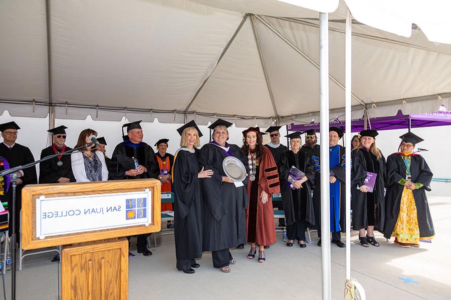 Pictured Center: SJC President Dr. Toni Hopper Pendergrass and SJC Foundation Executive Director Gayle Dean present Lori Schiess with the Allison Award at the 2024 SJC graduation ceremonies.